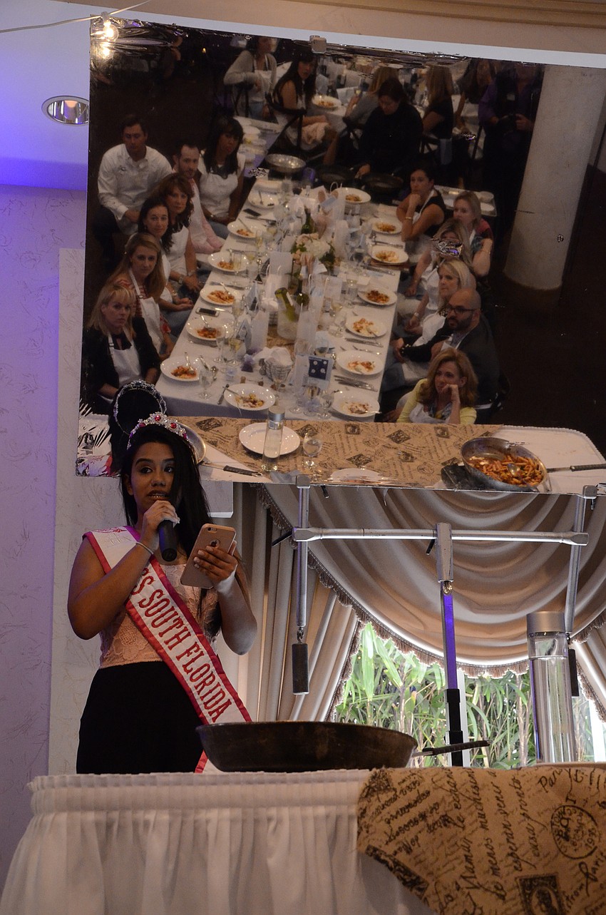 Kareliz Rodriguez tells the attendees about her experience with Make a Wish. Her wish was granted — to go to Paris and see the Eiffel Tower.