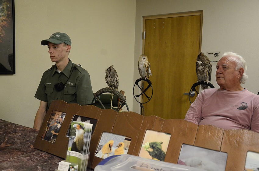 Wildlife, Inc., owners Devon and Ed Straight talk to parents about the tiny screech owl.