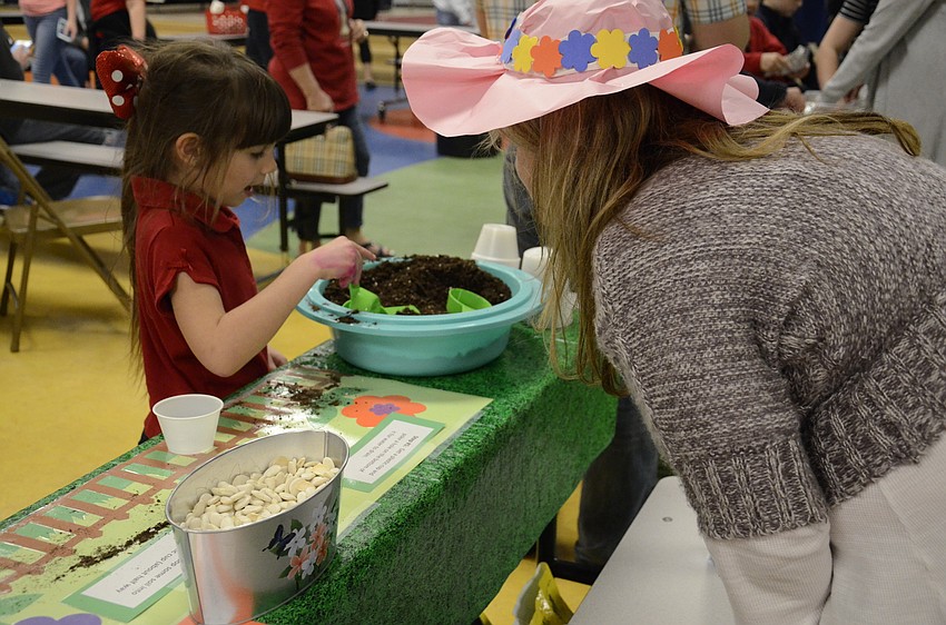 Zoe Rio talks with Wendy Bond about planting seeds.