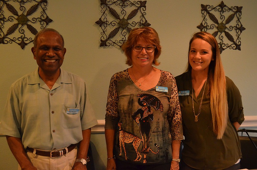 Siesta Isles Association Vice President Kumar Mahadevan with Janet Emanuel and Michelle Brown