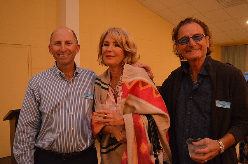 Siesta Isles Association President Tony Romanus with Susan Decker and Joel Fried