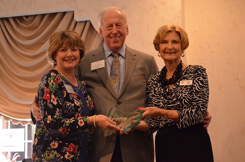 Sarasota County Libraraies & Historical Resources Direct Sarabeth Kalajian accepts the James E. Duffy Friend of Literacy Award from James Duffy and Carol Darling.