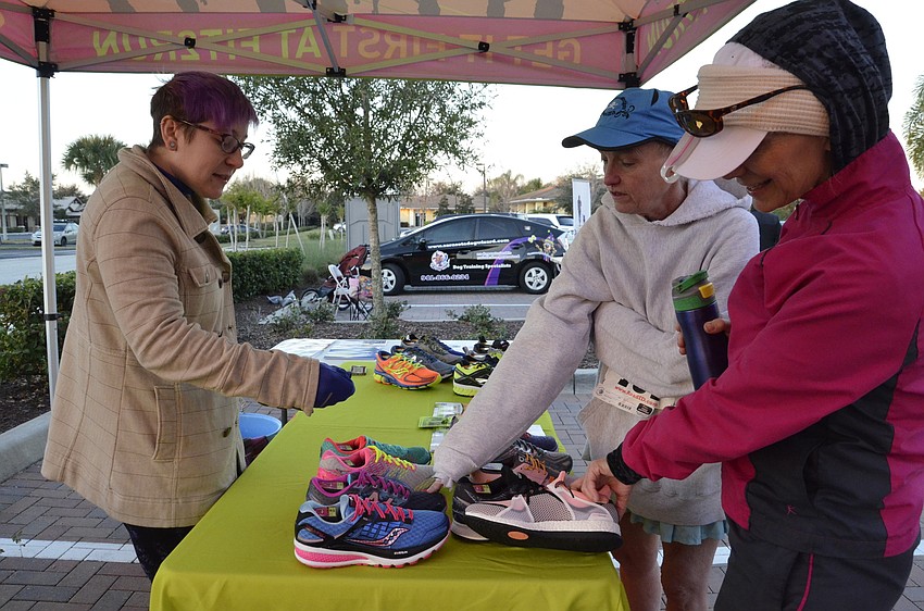 Jaime Tyler of Fit 2 Run at the UTC Mall chats with Jan Luck and Toni Halton of Apollo Beach,