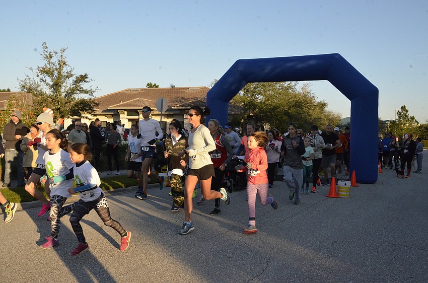 Runners take off for the 5K.