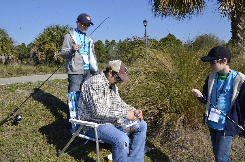 Hayden, Michael and Eli Johnson of Lakewood Ranch get their rigs ready to cast.