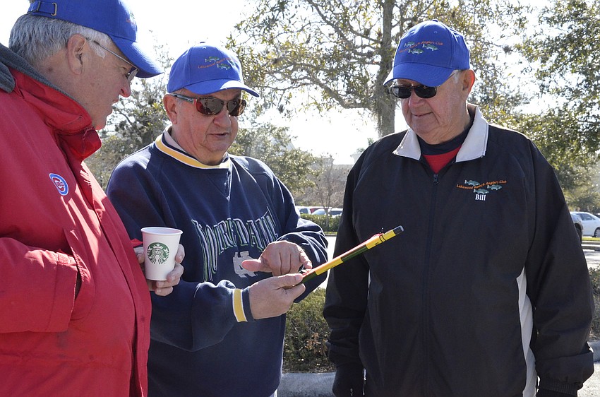 Angler's Club members Bob Pokorn, Tony Saviano and Bill Carroll admire Saviano's Tenkara Co. rod.