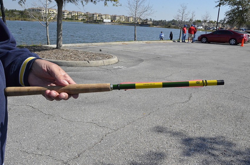 Angler's Club member Tony Saviano shows off his Tenkara rod. The rod is a method of fishing that is 2,000 years old and originates from Japan, he said. Unlike a typical rod, the Tenkara has no reel.