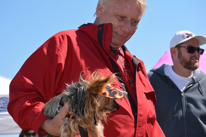 Bob Morrison of Heritage Harbor holds Diesel, a 15-year-old Yorkie.