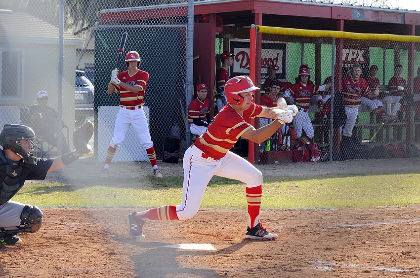 Cardinal Mooney's Tyler Strong puts down a bunt.