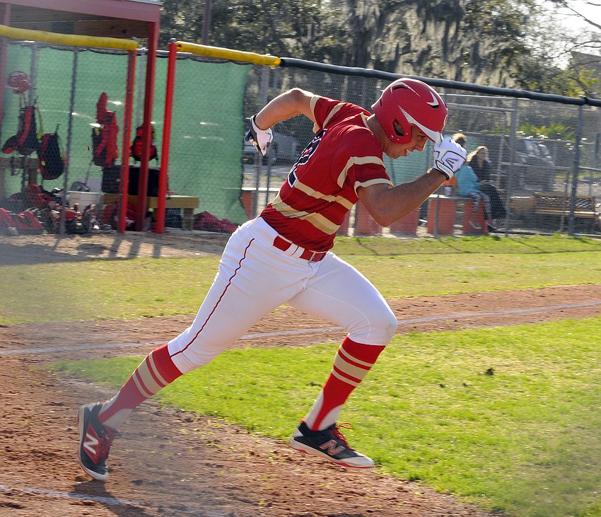 Cardinal Mooney's Tyler Strong races down the first base line.