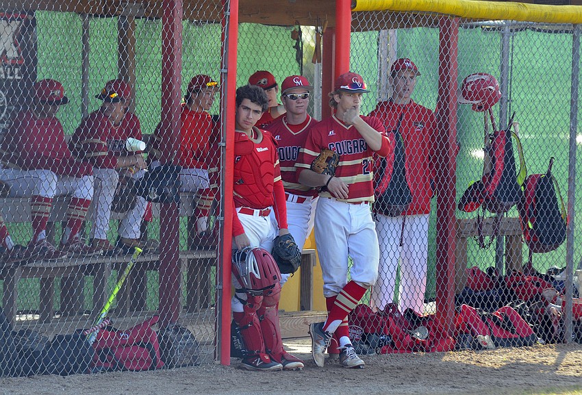 The Cardinal Mooney baseball team looks on during the Cougars non-district contest versus Lakewood Ranch Feb. 25.
