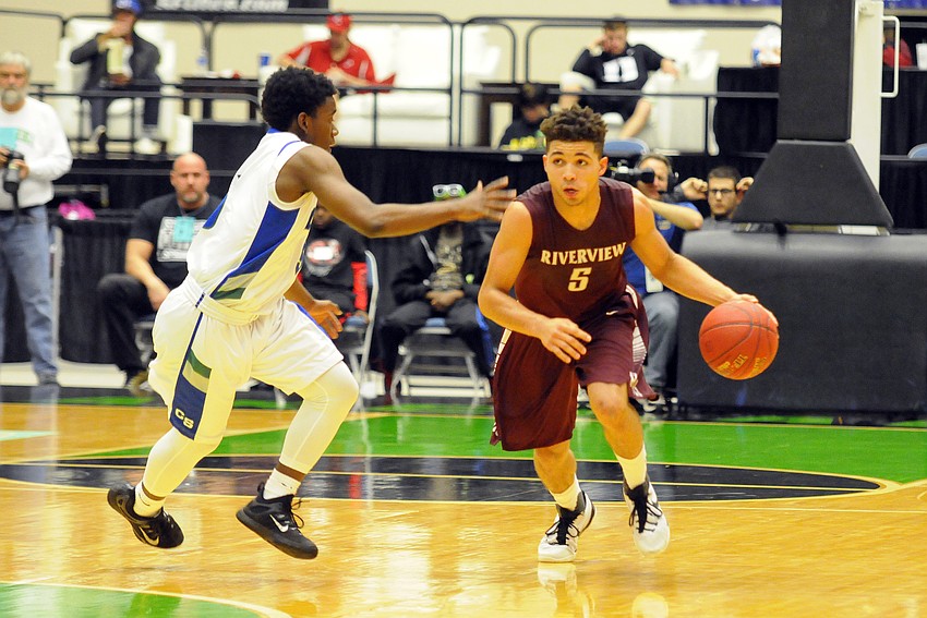 Riverview point guard D.J. Bryant brings the ball down the court.