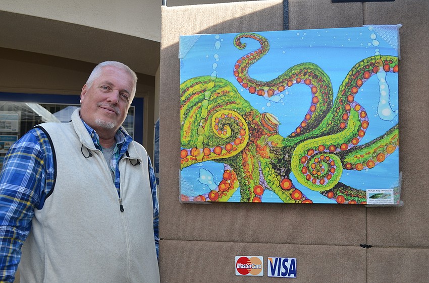 Kevin Ritter of Mungo Key Designs and one of his pieces on display at the 22nd annual Siesta Key Craft Festival.