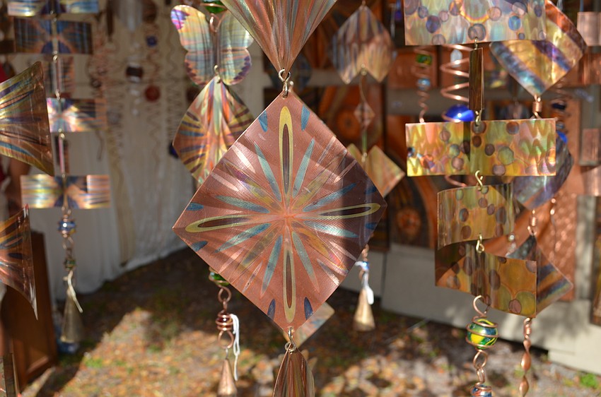 Metal work by Robert Boyce includes intricate designs.