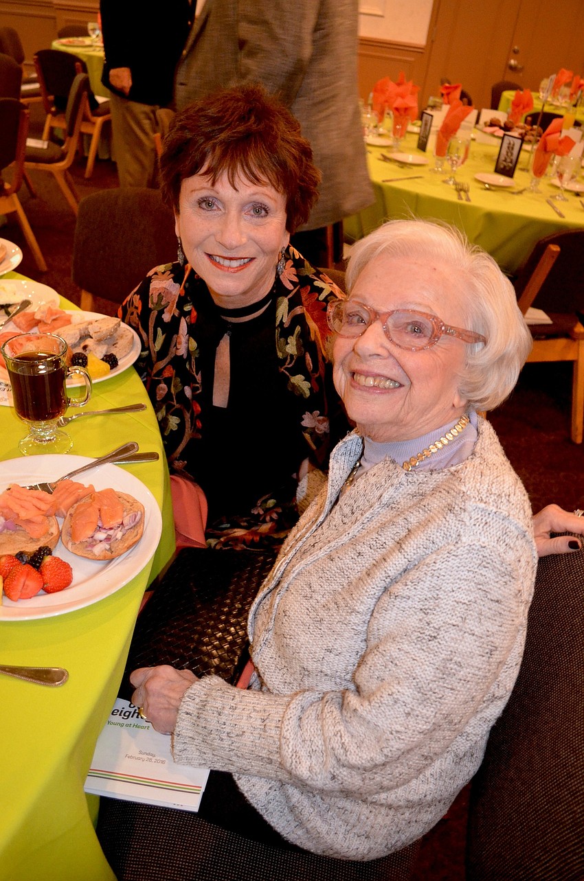 Meredith Ernst and Carryl Alexander snack on breakfast.