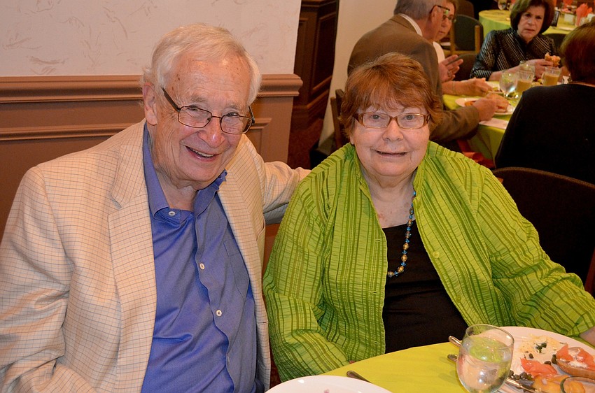 Bill and Marge Sandy find a quiet corner in the dining room.