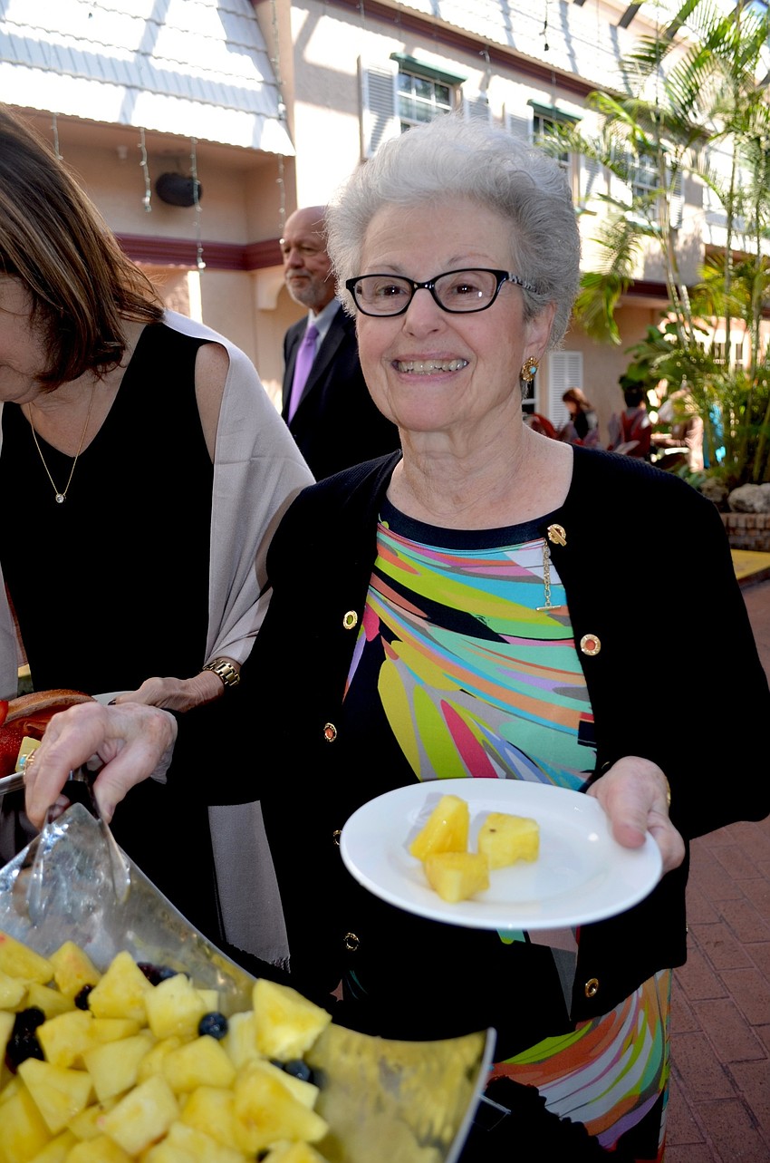 Isabel Becker munches on fruit for breakfast.