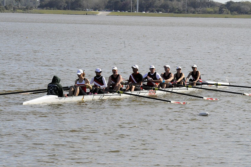 The Sarasota Rowing Club's Mixed Masters 8+ boat heads toward the starting line.