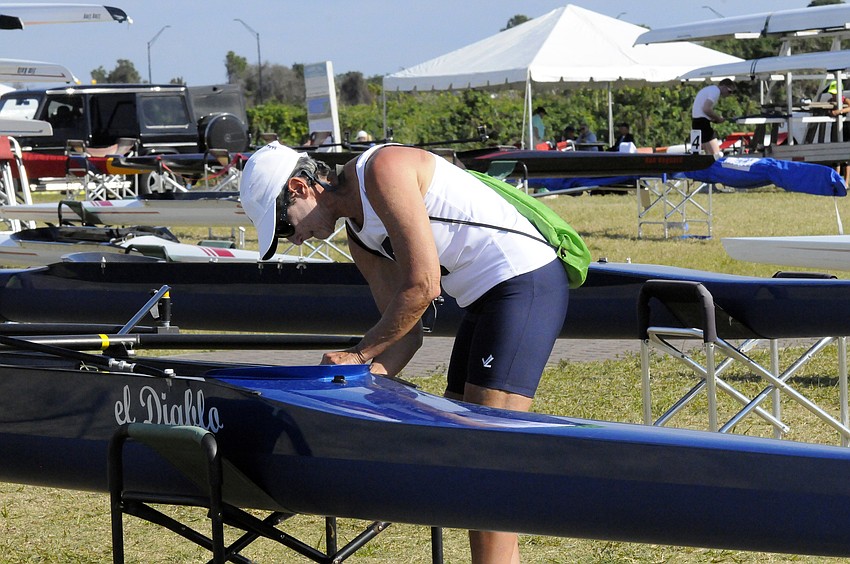 Sarasota Crew masters rower Barbara Shivers works on a boat in between races.