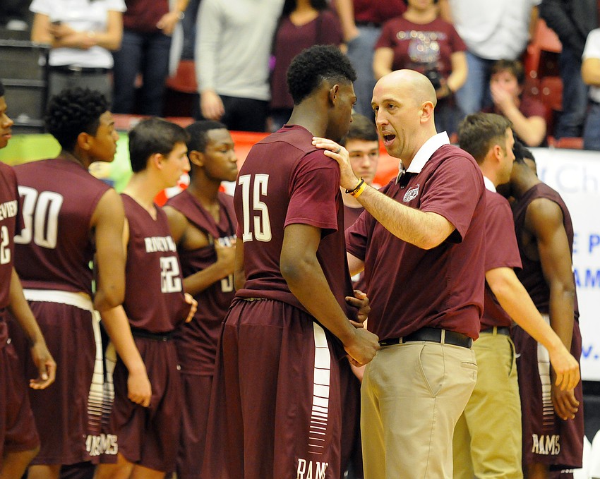 Riverview coach BJ Ivey talks with D'Myron Wright following the Rams' 61-57 loss to Coral Springs in the Class 8A state championship Feb. 27.