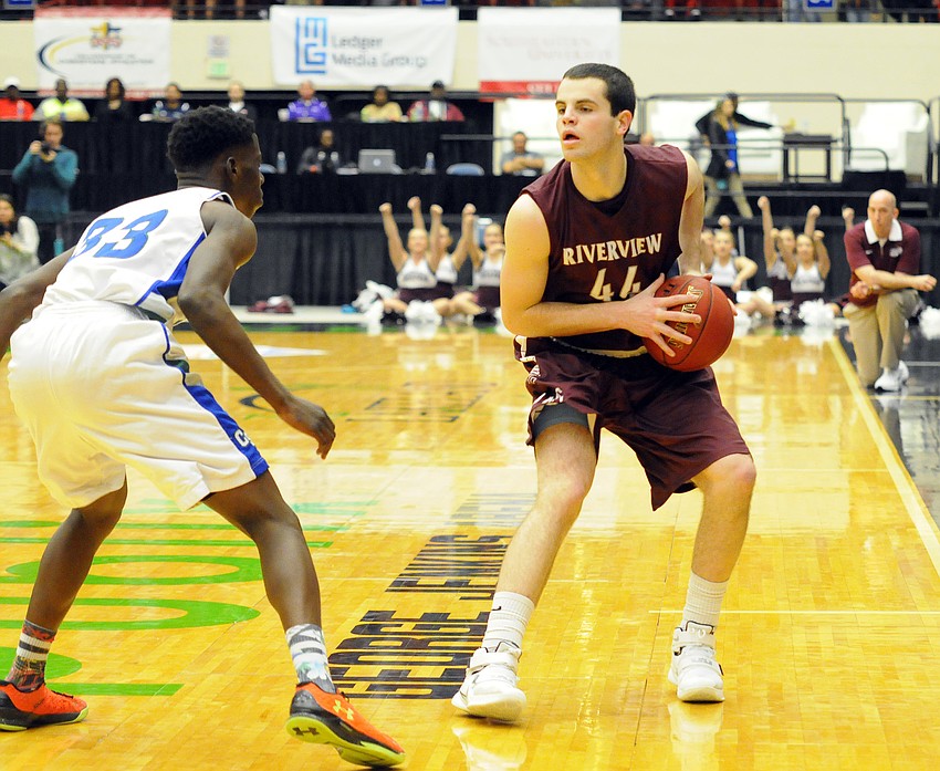 Riverview junior guard AJ Caldwell looks to pass the ball in the first half.