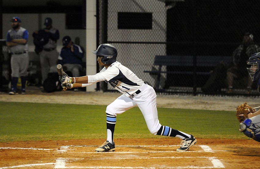 ODA freshman Austin Brinling looks to bunt in the first inning.