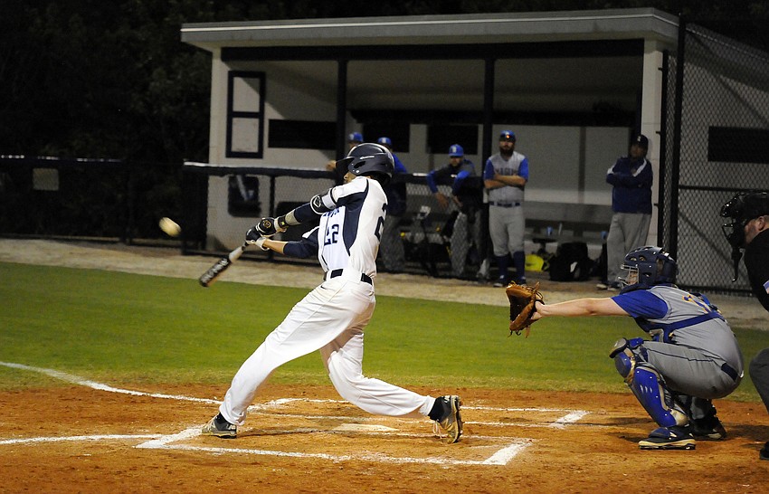 ODA junior Cameron Smalley his a sacrifice fly to score a run in the bottom of the first inning versus Imagine High Feb. 29.