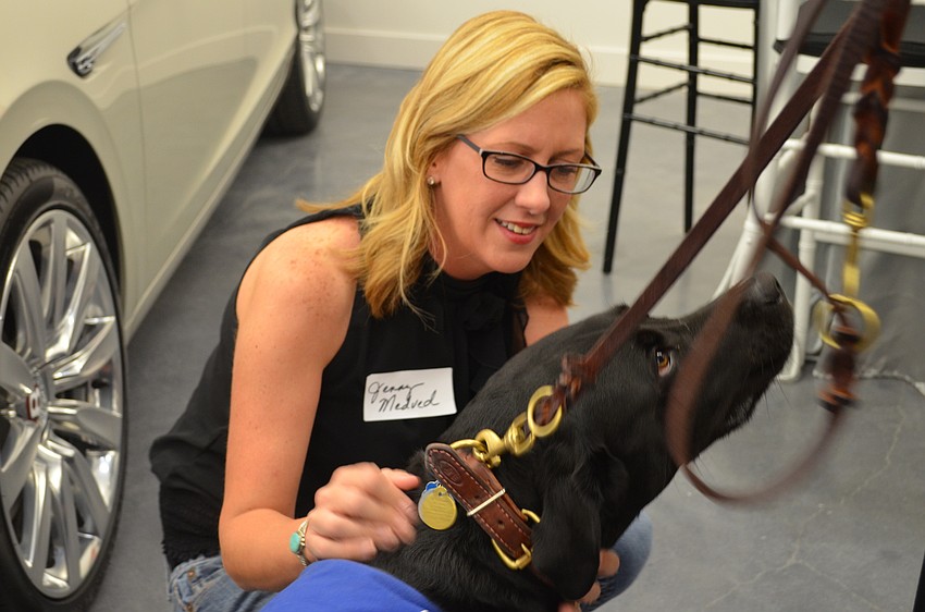 Artist Jenny Medved meets Southeastern Guide Dogs ambassador Theo.