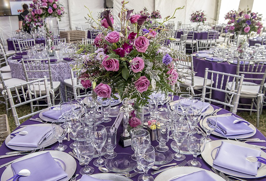 Beautiful tent and table decor with catering by Michael's On East