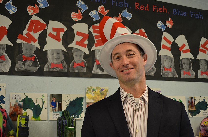 Goldie Feldman Academy Head of School Dan Ceaser dons the iconic red and white striped hat.