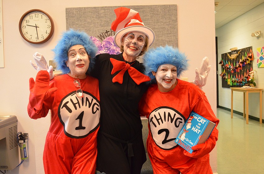 Rita Mazer as Thing 1, Sue Rosin as the Cat in the Hat and Wendy Katz as Thing 2 volunteered to hop from class to class delivering Dr. Seuss themed stickers.