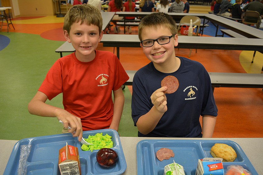 Braden River Elementary's Christopher Helf and Justin Cangro each tried a component of green eggs and ham.