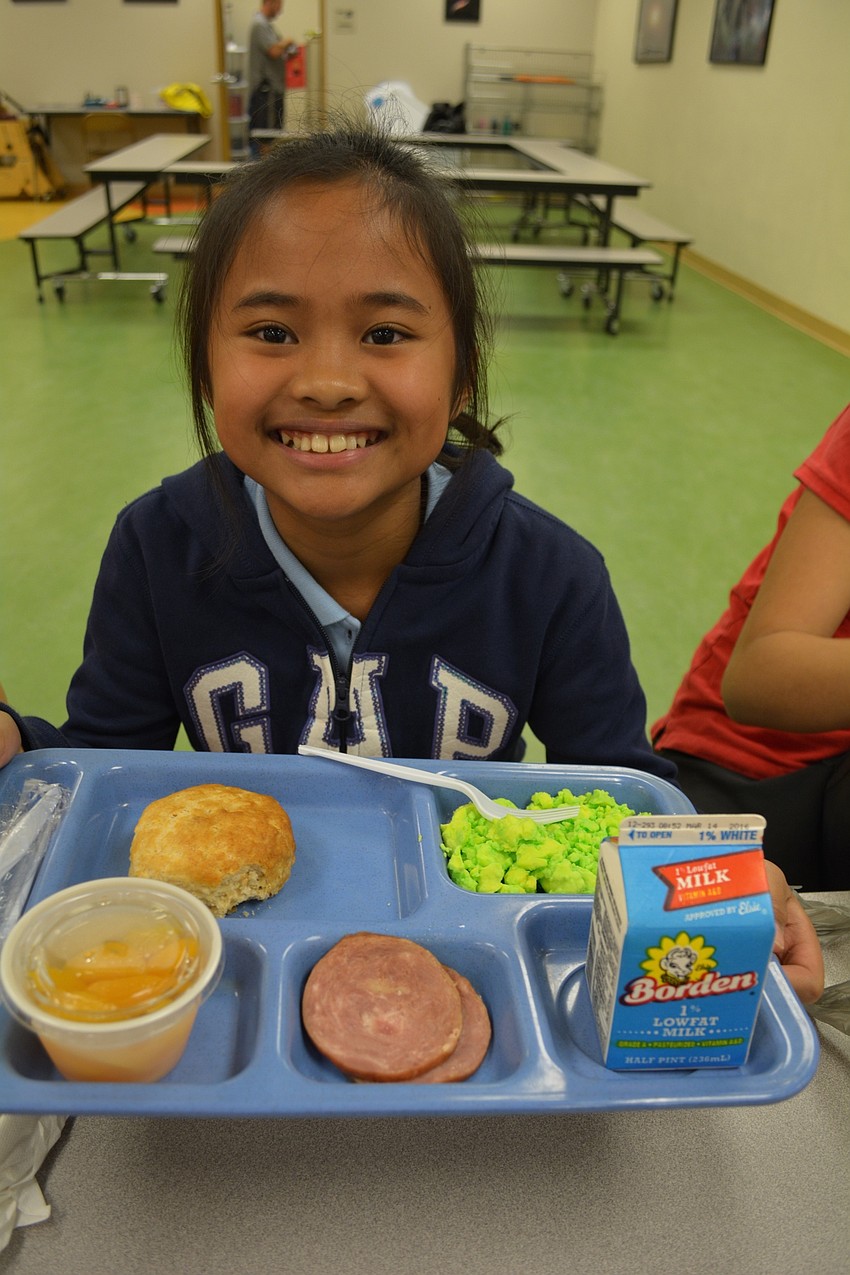 Braden River Elementary's Claudia Hidalgo, 10, tried green eggs because she likes eggs.