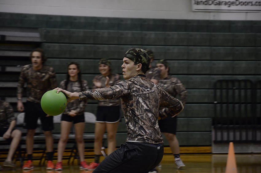 Chris Nikitopulous with the Invisibles gets ready to launch a ball.