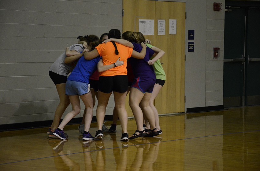 The Fruit Ninjas powwow before their match.