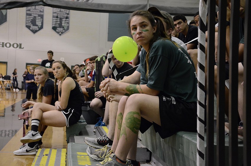 Samantha Pecht with the Junior ROTC team listens to the tournament rules before play begins.
