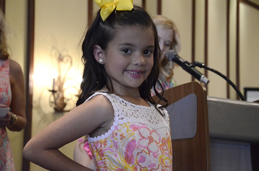 Riley Carvajal-Homan of Sarasota smiles on the runway.