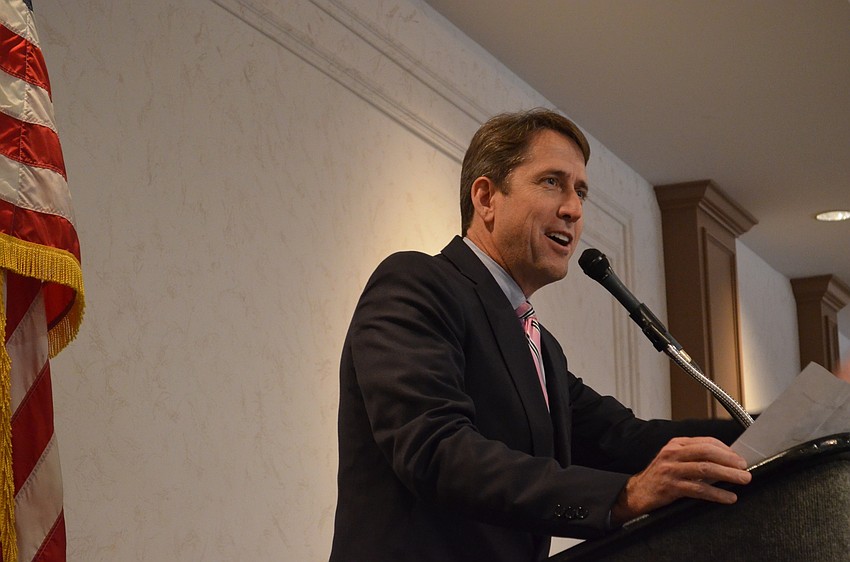 Tiger Bay Club Treasurer Morgan Bentley welcomes guests to the monthly meeting.