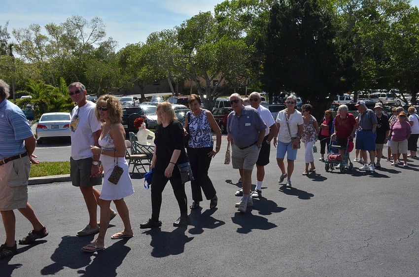 Visitors line up for the Early Bird Rummage Sale March 4.