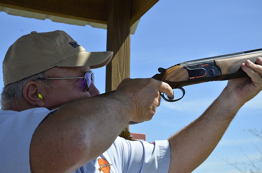 Russ Kelly said the purple lenses of his glasses help viewing contrast and allow him to see the clay better.