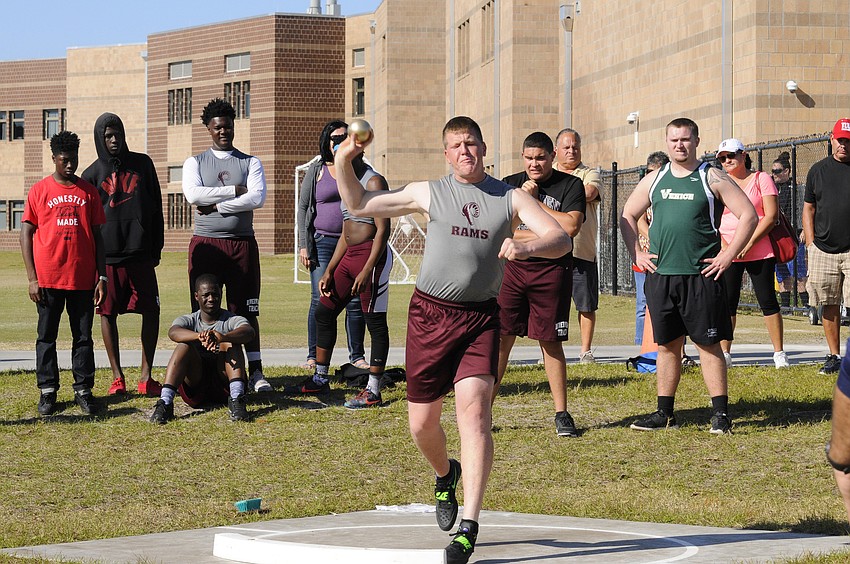Riverview's Peter Larson attempts a throw in the shot put.