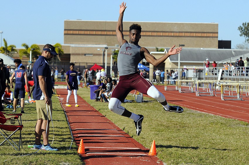 Riverview's Areon Green soars through the air during his first long jump attempt.