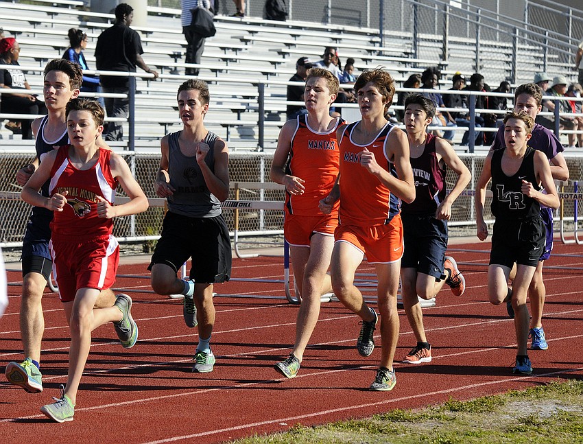 Distance runners compete in the consolation 1,600-meter run.