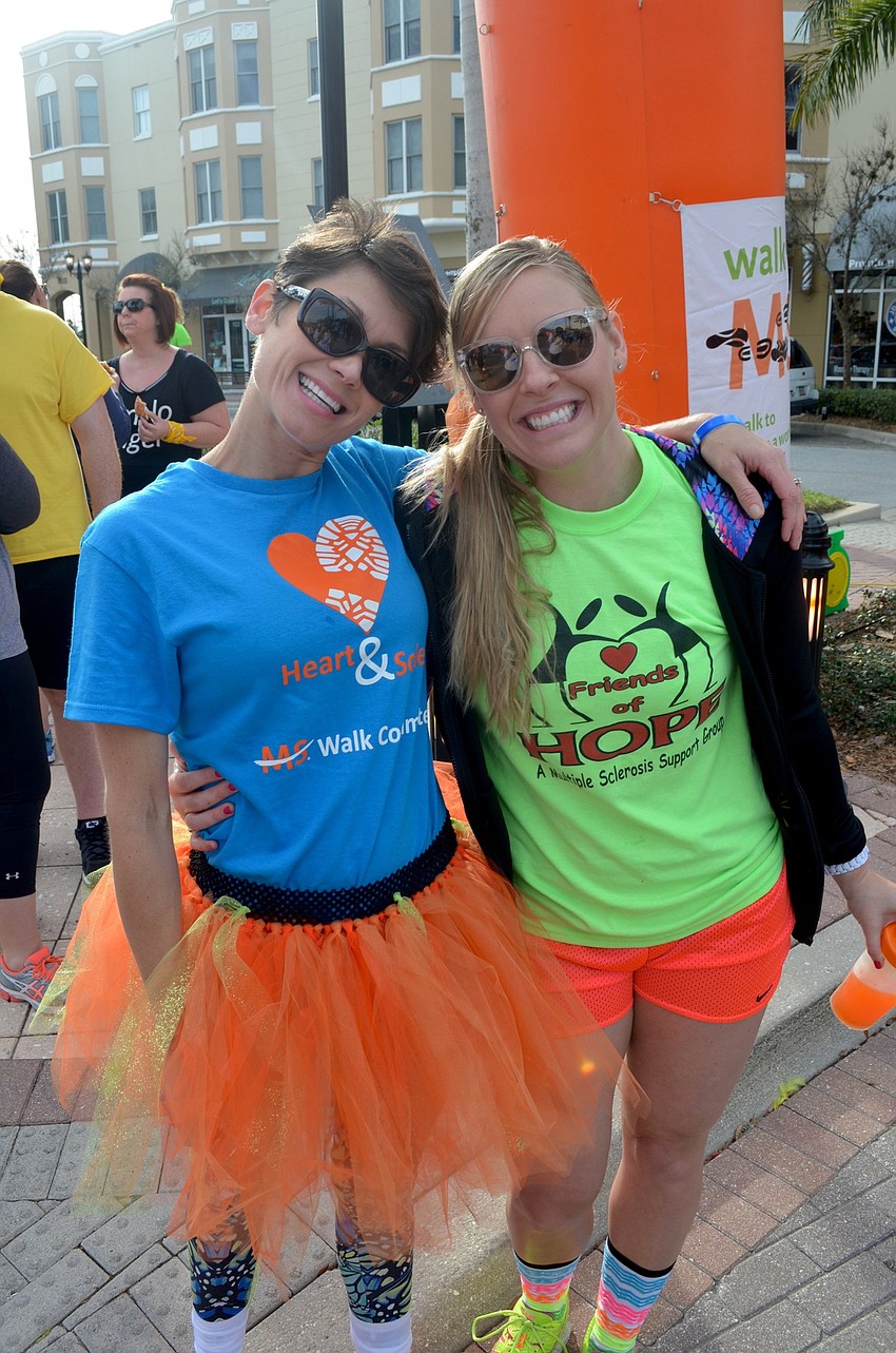 Event organizer Emily Pinho and Nicole Cook, of Bradenton, show off their orange pride for MS Month.