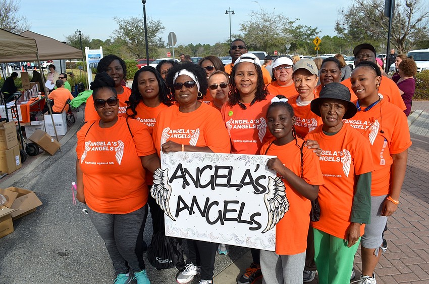Angela's Angels walk for Angela Bacon (front, center), who has MS.