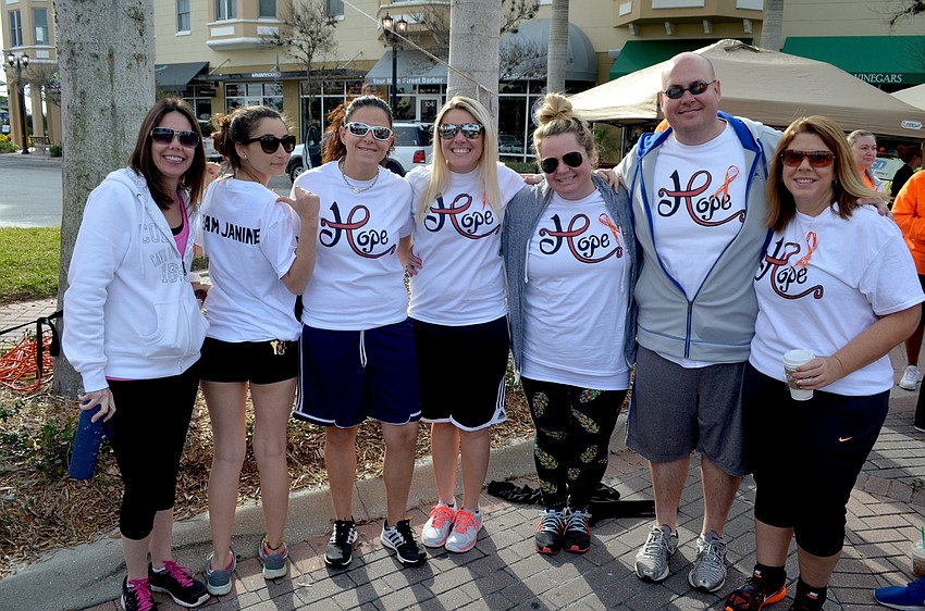 Team Janine members Mandi Eschenbach, Janeen Korman, Janine Rocca, Samantha Linder, Alex and Joe Walsh and Melanie Reda show off their team uniforms for the event.