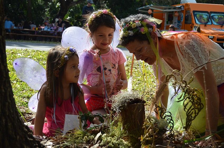 Leila and Olivia Schaedler-Luera learn to listen for fairies from Fairy of the Daisies Marilyn Schwartz.