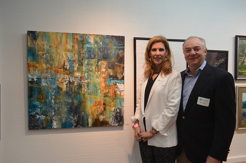 Artist Holly Miller and husband, Paul, with “Bridge and the Elements”