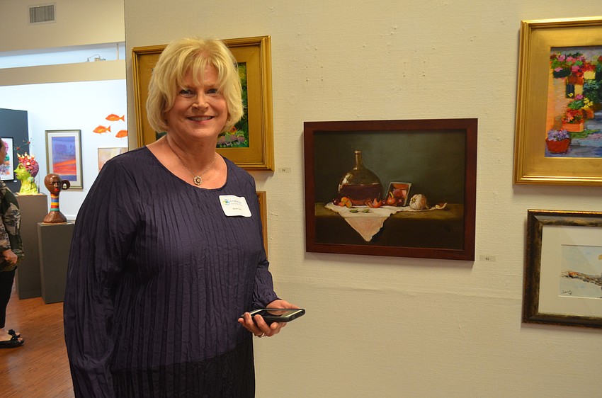 Artist Karen Geck, with “Still Life with Bottle”