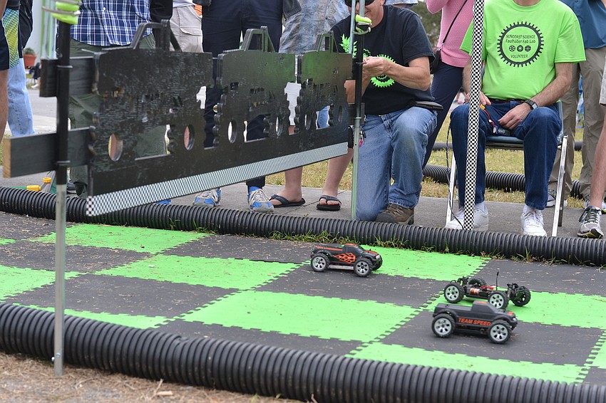 The gate is lifted for the start of another round of lap races where teams must navigate a course of obstacles.